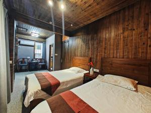 Postel nebo postele na pokoji v ubytování Wuyuan Koshin Homestay