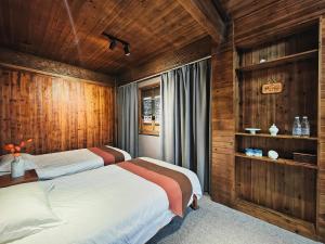 Postel nebo postele na pokoji v ubytování Wuyuan Koshin Homestay