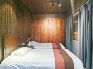Postel nebo postele na pokoji v ubytování Wuyuan Koshin Homestay