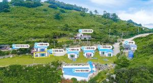 an aerial view of a house on a hill at Yokjido Pension Bluesea in Tongyeong