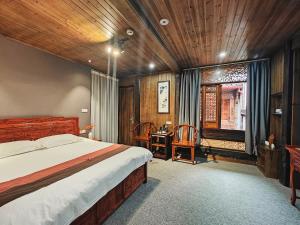 Postel nebo postele na pokoji v ubytování Wuyuan Koshin Homestay