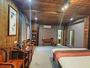 Postel nebo postele na pokoji v ubytování Wuyuan Koshin Homestay