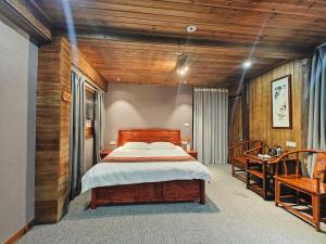 Postel nebo postele na pokoji v ubytování Wuyuan Koshin Homestay