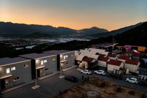 a group of buildings with cars parked in a parking lot at Pocheon Todam Kids Pool Villa All Kids Rooms in Pocheon