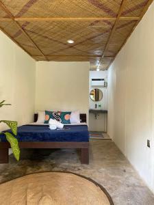 Postel nebo postele na pokoji v ubytování Dawn Patrol Siargao