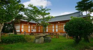 a building with a picnic table in front of it at Buan Dream of Butterfly Pension in Buan