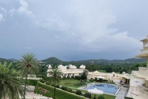a view of a building with a swimming pool at Labh Garh Palace Resort & Spa in Udaipur