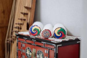 a group of donuts sitting on top of a table at Jeonju Hanok Village Artist’s House Sigan Moonui in Jeonju
