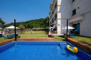 a swimming pool with a plastic toy in a building at Suncheon raon house egyeon pension in Suncheon