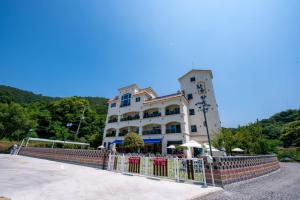 a building with a fence in front of it at Suncheon raon house egyeon pension in Suncheon +40 photos
