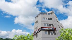 a building with a so house sign on it at Busan Go House Pension in Busan