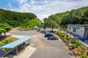 an aerial view of a parking lot with cars parked at Taean Scenic Pension in Taean