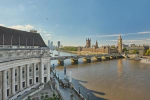 a view of a river with a bridge and a city at London Marriott Hotel County Hall in London