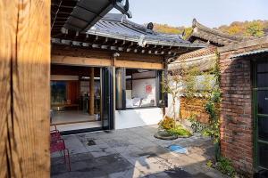 an outside view of a house with a patio at Luwa Private Pension in Jeonju