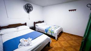 Postel nebo postele na pokoji v ubytování Casa Turística la Villa de Poli