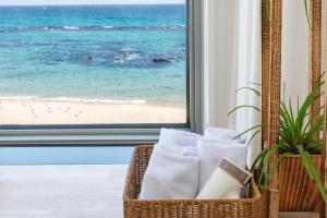 a room with a window with a view of the beach at Donghae Adal Ocean Pension in Donghae