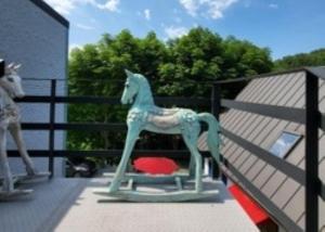 a plastic horse on the back of a house at Gapyeong House 2 71 Pension in Kŏjŏbi