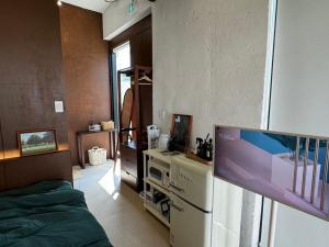 Una cocina o cocineta en Gyeongju Stayrophy Eupseong Branch