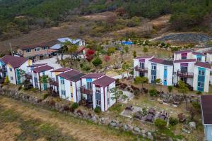 an aerial view of a row of houses on a hill at Everis UnI Pension in Sinan