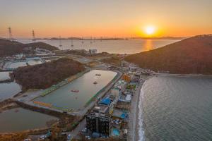 an aerial view of a beach at sunset at Daebudo Ara Pension in Ansan