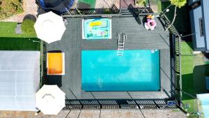 an overhead view of a swimming pool in a backyard at Rose Life Stay Pension in Taean