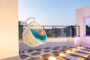 a swing hanging from the ceiling of a building at Gangneung ST153 in Kyŏngp'o-mal