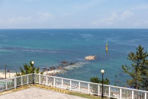 a view of the ocean from a balcony at Donghae Hill House Pension in Donghae
