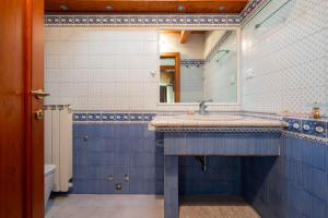 a bathroom with a sink and a mirror at 7º Cielo Comfort Apartment Venice - Mestre in Venice +61 photos