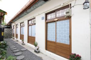 a row of doors on a white building at Dodam in Busan