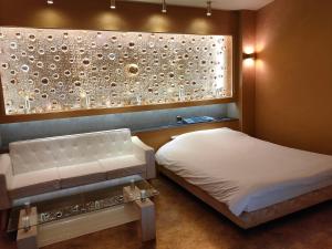 Postel nebo postele na pokoji v ubytování アネックス艶 -大人専用-