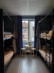 Postel nebo postele na pokoji v ubytování Bla Bla Hostel