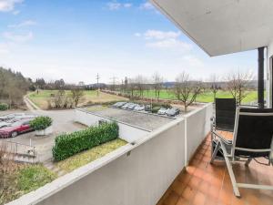 a balcony with a view of a parking lot at Gemütliches Terrassenhaus in Degerfelden