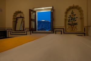 Raghunath Haveli - A Boutique Homestay客房内的一张或多张床位