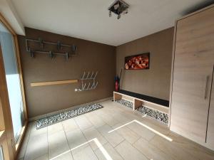 a room with a walk in shower and a wall at Apart Kathrein in Mathon +25 photos
