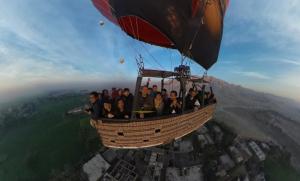 a group of people riding on a hot air balloon at Moka Gust House in Luxor