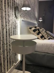 Postel nebo postele na pokoji v ubytování Logis Hôtel Le Glacier