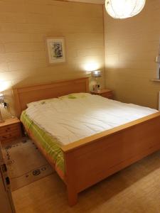 a bedroom with a large bed in a room with two tables at Willingen-Schwalefeld-Hasewinkel in Schwalefeld +20 photos