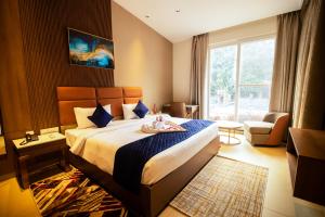 Voodi või voodid majutusasutuse Ananthyam Resort by Anukulas toas