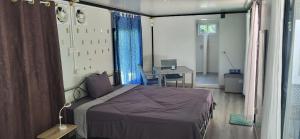 Voodi või voodid majutusasutuse Corsita Resort Koh Mak toas
