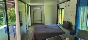 Voodi või voodid majutusasutuse Corsita Resort Koh Mak toas
