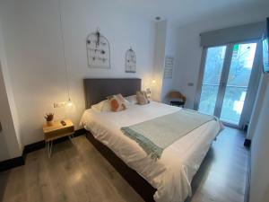 Posteľ alebo postele v izbe v ubytovaní Stay U-nique Apartments Rosaleda