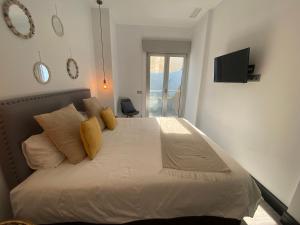 Posteľ alebo postele v izbe v ubytovaní Stay U-nique Apartments Rosaleda