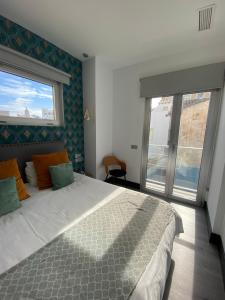 Posteľ alebo postele v izbe v ubytovaní Stay U-nique Apartments Rosaleda
