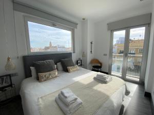 Posteľ alebo postele v izbe v ubytovaní Stay U-nique Apartments Rosaleda