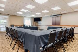 a conference room with a long table and chairs at Lift Bridge Lodge, an Ascend Collection Hotel in Duluth
