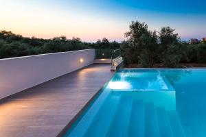 a swimming pool in the backyard of a house at Estel Residences in Chania Town