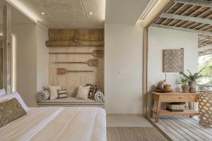 Ein Bett oder Betten in einem Zimmer der Unterkunft Phangan Bayshore Resort Koh Phangan