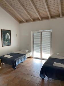 Postel nebo postele na pokoji v ubytování PARAÍSO DA SERVA - Casas Courela da Serva e Flor do Rosto I e II