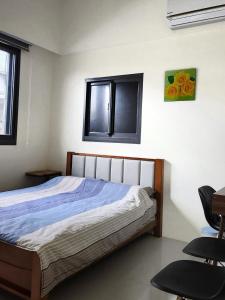 Kama o mga kama sa kuwarto sa Yun B&B