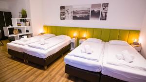 Postel nebo postele na pokoji v ubytování Hirsch Hotel Hanau + 3 fotografie